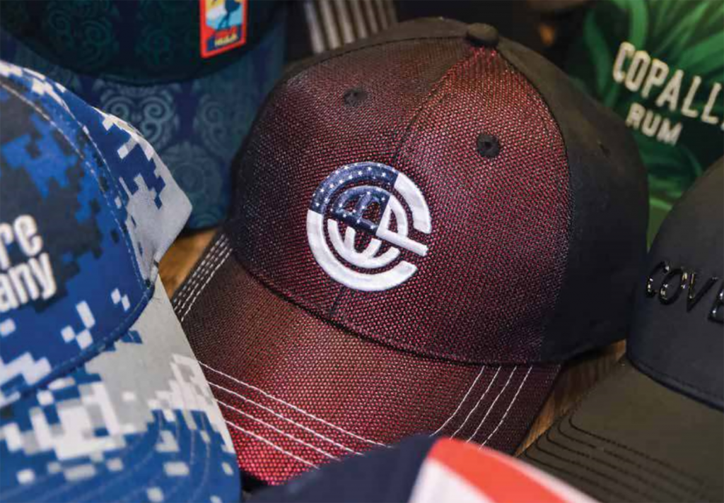 Featured image for custom cap blog post showing multiple hats in various colors and decoration options.